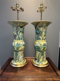 A pair of Chinese verte biscuit 'gu' vases with gilt bronze lamp mounts, 19th C.