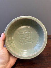 A Chinese Longquan celadon dish with floral anhua design, Ming
