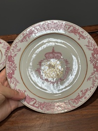 A pair of monogrammed Chinese puce-enamelled plates and a pair of armorial cups and saucers, Yongzheng/Qianlong