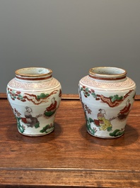 A pair of small Chinese wucai jars with figures in a landscape, Transitional period