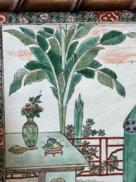 Een rechthoekige Chinese famille verte plaquette in houten imitatiebamboe kader, Kangxi