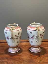 A pair of Chinese famille rose 'cornucopia' vases with chilong handles, Qianlong