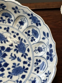 A pair of Chinese blue and white 'Mongolian hunting scene' plates and a pair of plates with floral design, Chenghua and Kangxi mark, Kangxi