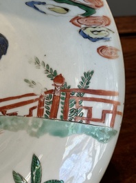 A Chinese famille verte 'qilin and falcon' plate, artemisia leaf mark, Kangxi