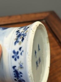 A pair of Chinese blue, white and copper-red vases and covers, Kangxi mark, 19th C.