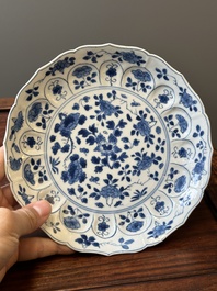 A pair of Chinese blue and white 'Mongolian hunting scene' plates and a pair of plates with floral design, Chenghua and Kangxi mark, Kangxi