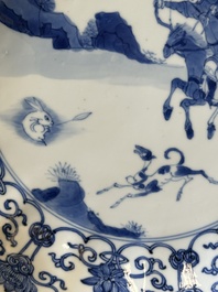 A pair of Chinese blue and white 'Mongolian hunting scene' plates and a pair of plates with floral design, Chenghua and Kangxi mark, Kangxi