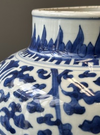 A Chinese blue and white 'lotus scroll' jar with wooden cover and stand, Kangxi