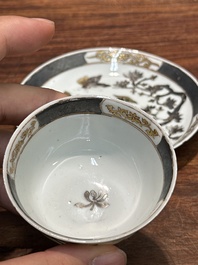 A pair of Chinese grisaille and gilt 'pheasant' cups and saucers, Yongzheng