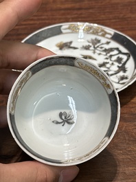 A pair of Chinese grisaille and gilt 'pheasant' cups and saucers, Yongzheng