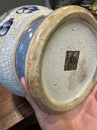 A pair of Chinese blue and white Nanking crackle-glazed 'Taoist' vases, 19th C.