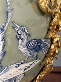 A pair of Chinese blue and white celadon-ground vases with gilt bronze mounts, 19th C.