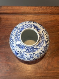 A pair of Chinese blue and white covered vases and three jars, 19th C.