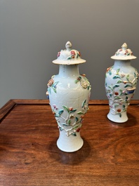 A pair of Chinese famille rose covered vases and a plate with applied floral design, Yongzheng