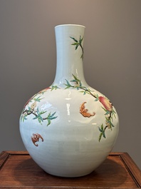 A Chinese famille rose relief-molded 'tianqiuping' vase with nine peaches, Qianlong mark, 19/20th C.