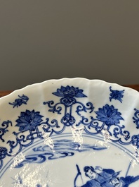 A pair of Chinese blue and white 'Mongolian hunting scene' plates and a pair of plates with floral design, Chenghua and Kangxi mark, Kangxi