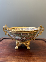 A Chinese Canton famille rose reticulated basket on stand and a bowl with gilt bronze mounts, 19th C.