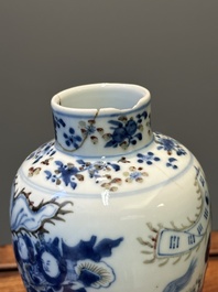 A pair of Chinese blue, white and copper-red vases and covers, Kangxi mark, 19th C.