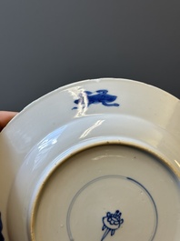 A pair of Chinese blue and white 'Buddhist lion' plates, ding mark, Kangxi