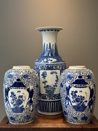 A pair of Chinese blue and white jars and a vase, Kangxi mark, 19th C.