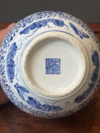 A pair of Chinese blue and white covered vases and three jars, 19th C.