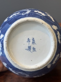 A pair of Chinese blue and white covered vases and three jars, 19th C.