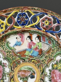A pair of Chinese blue and white Canton-decorated plates, a famille rose 'playing boys' plate and a reticulated plate, 19th C.
