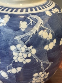 A pair of Chinese blue and white covered vases and three jars, 19th C.