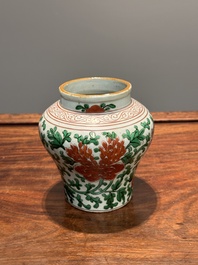 A small Chinese wucai 'Buddhist lion and peony scroll' jar, Transitional period