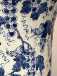 Two Chinese blue and white 'gu' vases with squirrels among grape vines, Kangxi