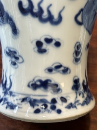 A pair of Chinese blue and white covered vases and three jars, 19th C.