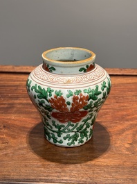 A small Chinese wucai 'Buddhist lion and peony scroll' jar, Transitional period