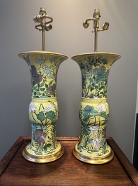 A pair of Chinese verte biscuit 'gu' vases with gilt bronze lamp mounts, 19th C.