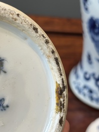 A pair of Chinese blue and white covered vases and three jars, 19th C.