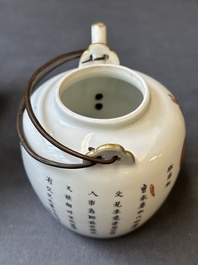 A pair of Chinese famille rose four-tier stacking boxes and a teapot, 19th C.