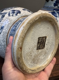 A pair of Chinese blue and white Nanking crackle-glazed 'Taoist' vases, 19th C.