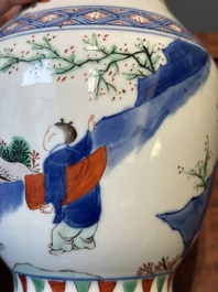 A Chinese wucai vase with figures and calligraphy, Transitional period