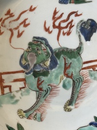 A Chinese famille verte 'qilin and falcon' plate, artemisia leaf mark, Kangxi