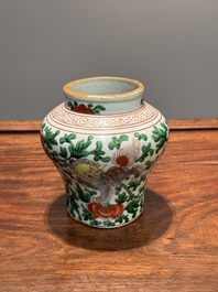 A small Chinese wucai 'Buddhist lion and peony scroll' jar, Transitional period