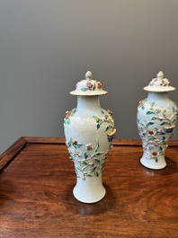 A pair of Chinese famille rose covered vases and a plate with applied floral design, Yongzheng