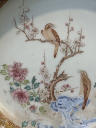 A pair of Chinese famille rose 'magpie and peony' plates with bianco-sopra-bianco rims, Yongzheng