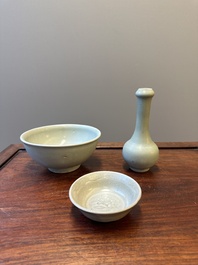 A Chinese celadon-glazed bottle vase and two bowls, Yuan/Ming