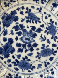 A pair of Chinese blue and white 'Mongolian hunting scene' plates and a pair of plates with floral design, Chenghua and Kangxi mark, Kangxi