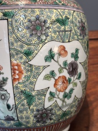A Chinese famille verte covered vase and a bottle vase, 19th C.