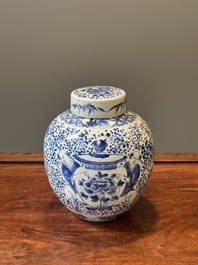 A pair of Chinese blue and white covered vases and three jars, 19th C.