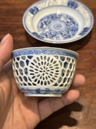 A Chinese blue and white reticulated double-walled cup and saucer, Kangxi