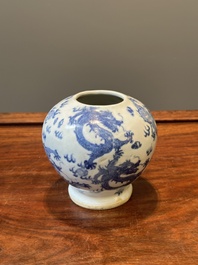 A pair of Chinese blue and white covered vases and three jars, 19th C.