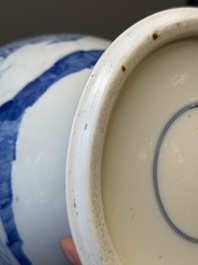 A pair of Chinese blue and white covered vases with figural design, 19th C.