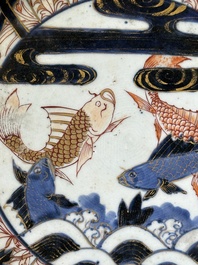 A Japanese Imari dish with carps among waves and clouds, Edo, 17th C.