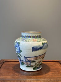 A Chinese wucai 'qilin' baluster vase, 19th C.